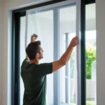 phoenix-10-a-man-installing-or-fitting-a-mosquito-net-or-insec-1-6909bedcdd7ab